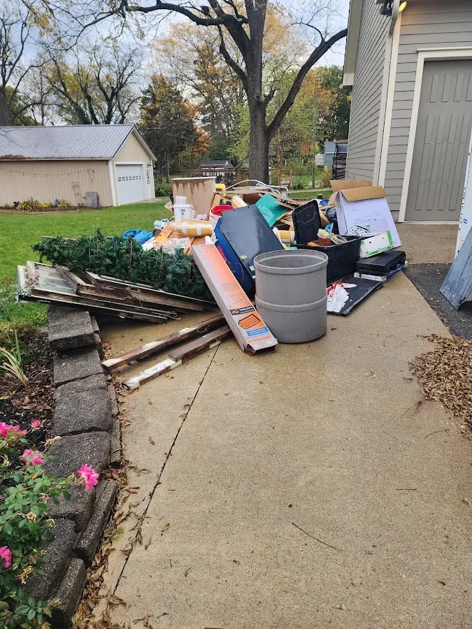 Dumpster being loaded with debris for Demolition Dumpster Rental in Russell
